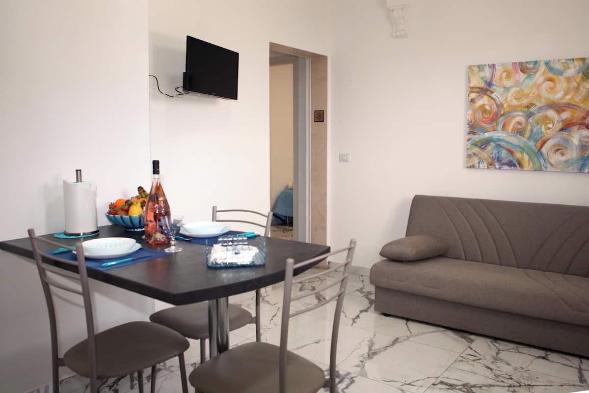 Standard Apartment, Multiple Bedrooms (Pino 6 - 1 bedroom Near The Sea) | Living area | 21-inch TV with cable channels