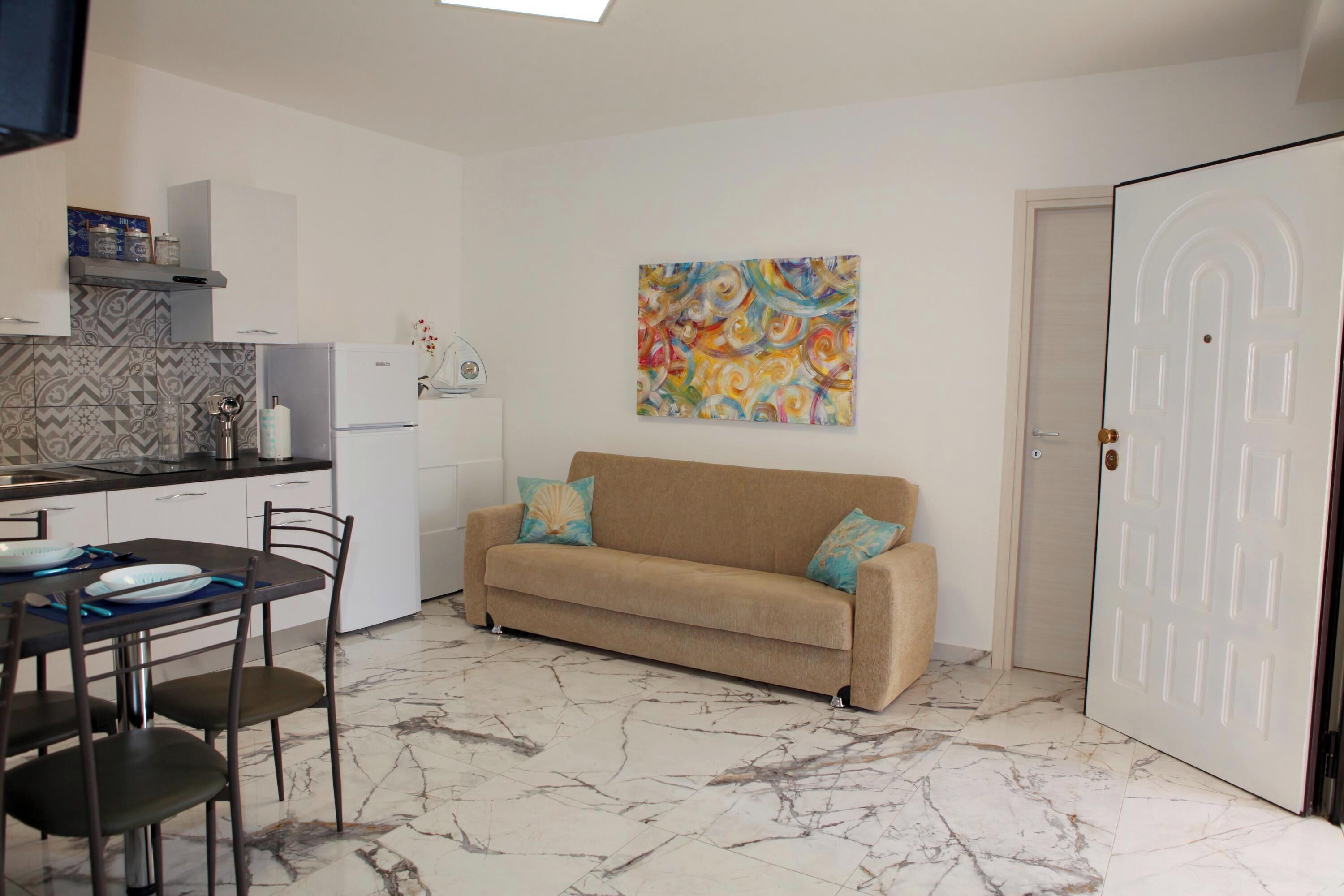 Standard Apartment, Multiple Bedrooms (Pino 3 - 2 bedrooms Near The Sea) | Living area | 21-inch TV with cable channels