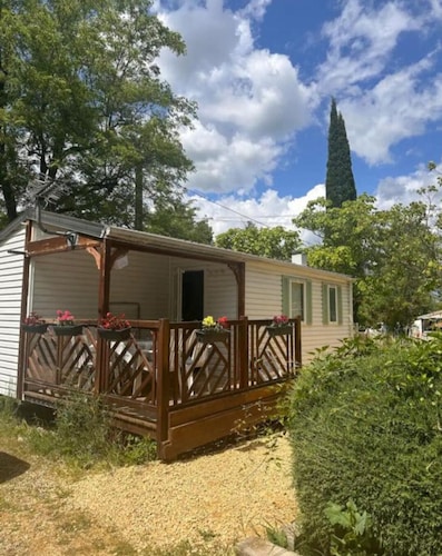 Mobile home on the banks of the Ardèche and the medieval village of Aiguèze