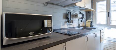 Fridge, microwave, cookware/dishes/utensils