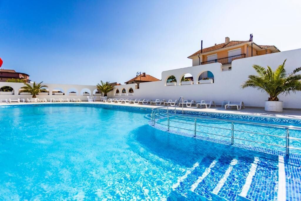 Indoor pool, outdoor pool, open 9:00 AM to 8:00 PM, pool umbrellas