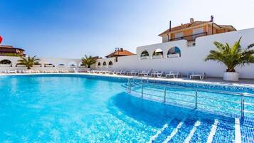 Indoor pool, outdoor pool, open 9:00 AM to 8:00 PM, pool umbrellas