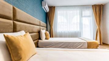Hypo-allergenic bedding, free minibar, in-room safe, desk