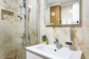 Shower, free toiletries, hair dryer, slippers