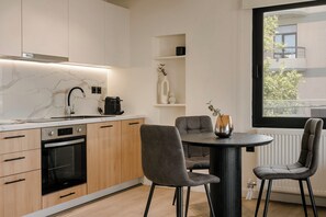 Superior Apartment, 1 Bedroom, Balcony, City View | Private kitchen | Fridge, oven, stovetop, dishwasher