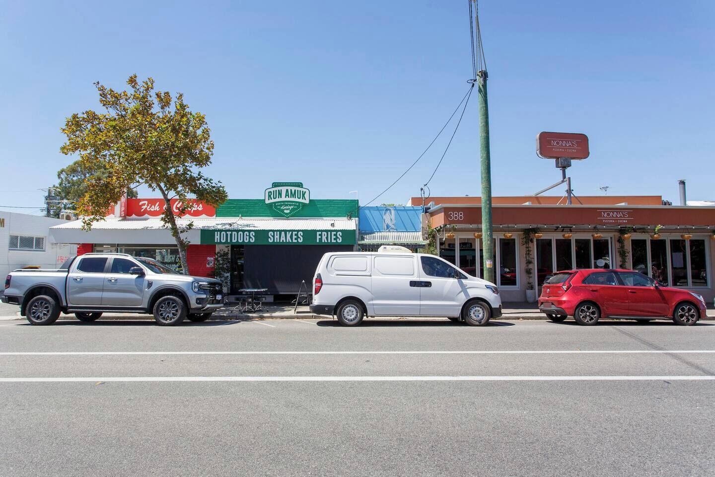 A street view with a restaurant named 'Run Amuk' and 'Nonna's Pizzeria'.