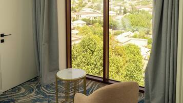 Deluxe Double or Twin Room, City View | In-room safe, desk, laptop workspace, blackout drapes