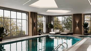 Indoor pool, open 7:30 AM to 10:30 PM, pool loungers, lifeguards on site