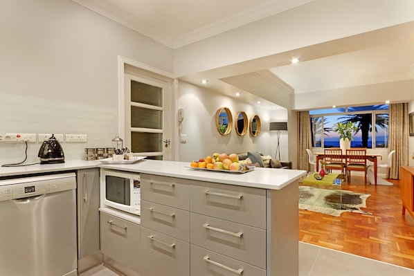 Luxury Apartment, Sea View | Private kitchen | Electric kettle, toaster, dining tables