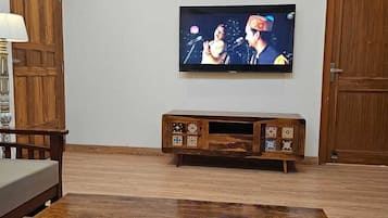 Triple Room | Living area | Flat-screen TV