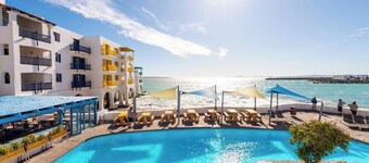 Luxe Beachside Retreat | Patio | Resort Perks
