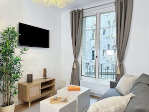 Apartment, Courtyard View | Living area | 80-cm Smart TV with digital channels