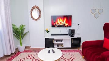 Luxury Apartment, Golf View | Living area | Flat-screen TV, DVD player