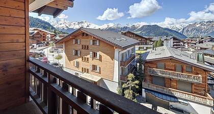 An open plan kitchen with dining area, a sitting area, a double bedroom with en-suite bathroom, a si