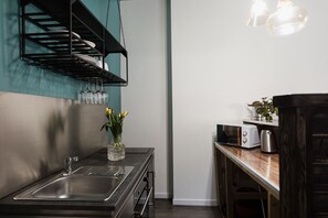 Fridge, microwave, electric kettle, cookware/dishes/utensils
