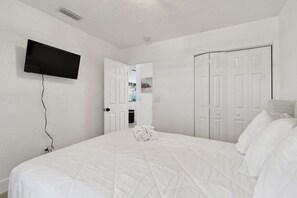 Relax in comfort with a large bed and flat-screen TV.