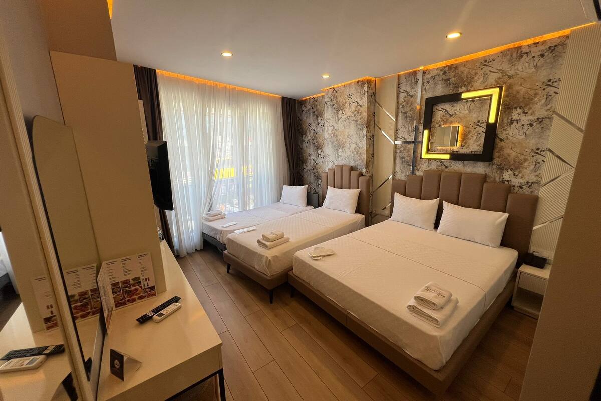 Deluxe Quadruple Room, Non Smoking, City View | Desk, laptop workspace, soundproofing, WiFi (free)