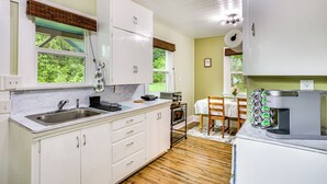 A kitchen with white cabinets, a sink, and a coffee maker. - Mt Rainier Retreat 7 Mi to Park Entrance! (Ashford)