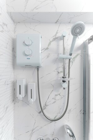 Shower, hair dryer, towels, soap