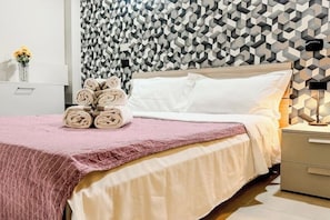 1 bedroom, desk, iron/ironing board, travel crib