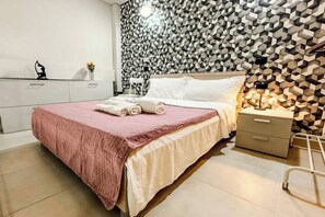 1 bedroom, desk, iron/ironing board, travel cot