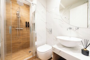 Shower, hair dryer, towels, soap