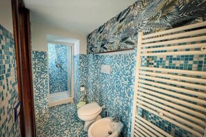 Shower, eco-friendly toiletries, hair dryer, bidet