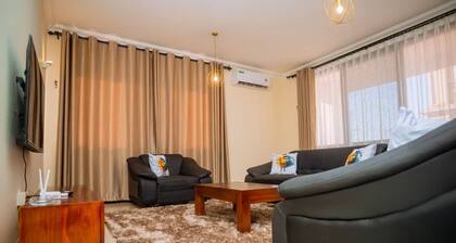 Chic 2-bedroom apartment with WiFi, pool fitness room in fabulous Dar es Salaam