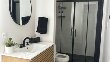 Shower, hair dryer, towels, soap