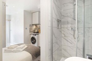 Shower, hair dryer, towels