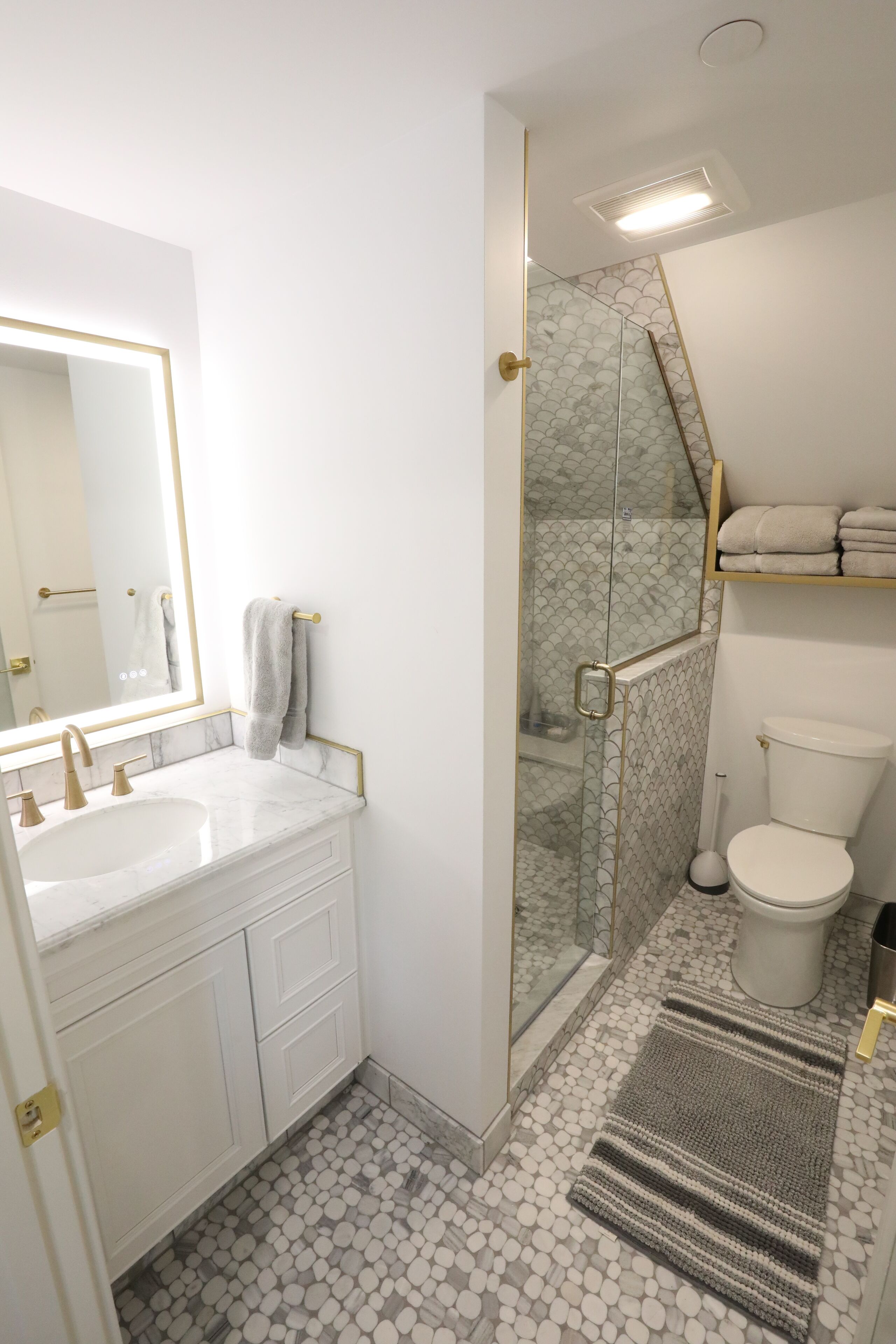 Shower, towels, soap, toilet paper