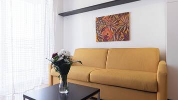 Apartment (1 Bedroom) | Living area | 32-inch Smart TV with cable channels
