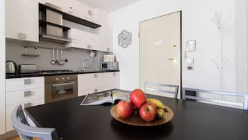 Apartment (1 Bedroom) | Living area | 32-inch Smart TV with cable channels