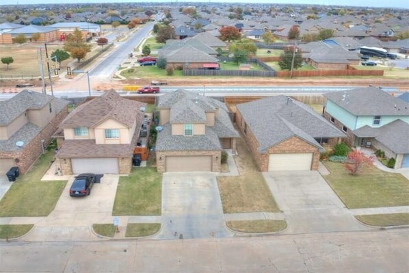 Single-family homes with pitched roofs and attached garages line the streets of this suburban community.