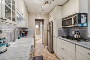 Fridge, microwave, coffee/tea maker, toaster