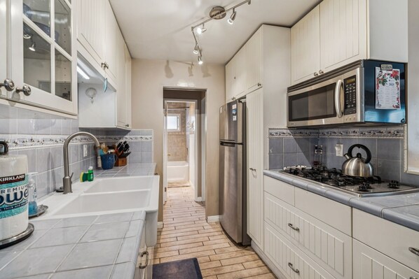 Fridge, microwave, coffee/tea maker, toaster