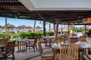 Outdoor dining - Beachfront Bliss – Cozy Studio with Pool & Resort Access (Puerto Vallarta)