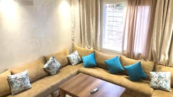 Grand Apartment | Living area | Plasma TV, first-run movies, pay movies