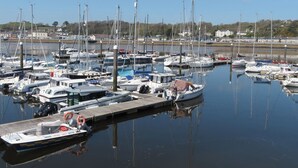 A marina with various boats docked at piers. - Bryn Caled (Pwllheli)