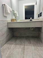 Designer toiletries, towels, soap, shampoo
