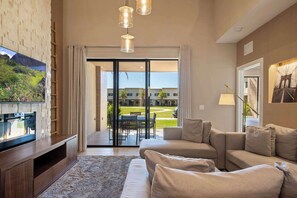 Townhome, Multiple Beds, Patio, Garden View (3056RW MVV) | Living area | 42-inch flat-screen TV with digital channels