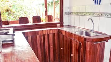 Comfort Cabin, Garden View | Private kitchen | Full-size fridge, oven, stovetop, cookware/dishes/utensils