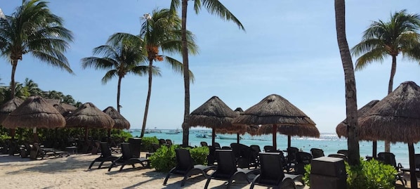 Private beach, white sand, sun loungers, beach umbrellas