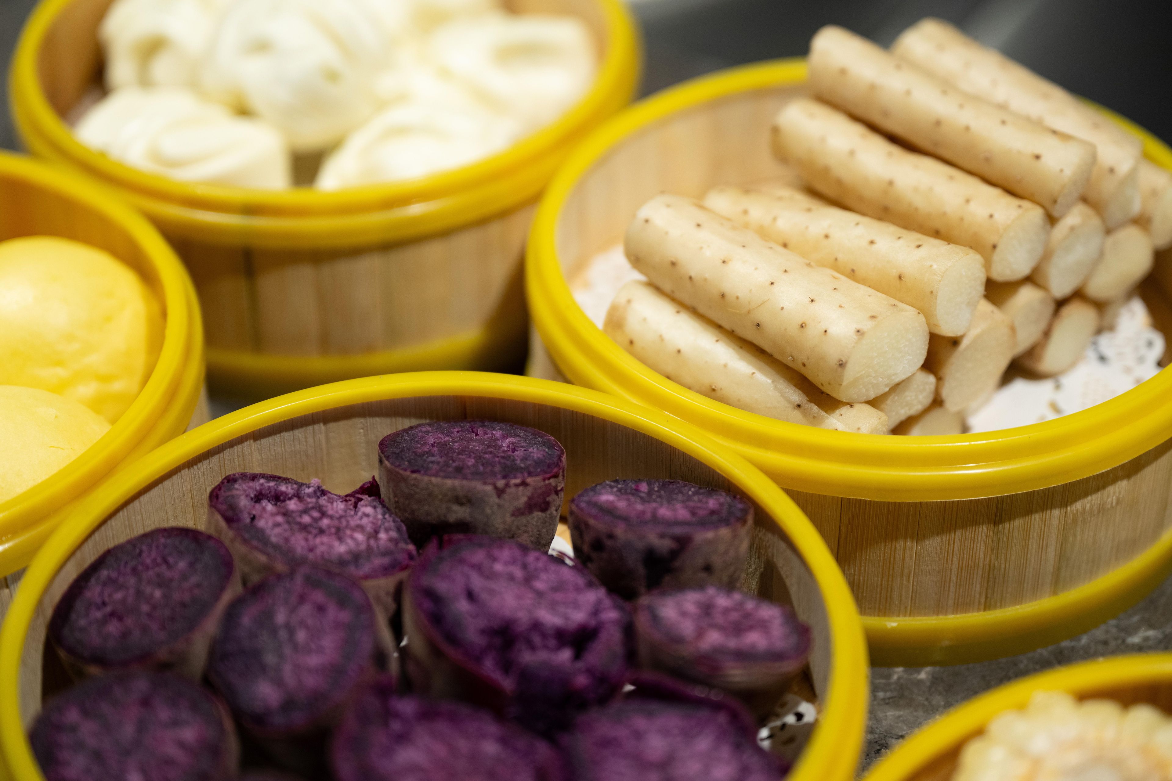 A variety of food items in yellow containers.