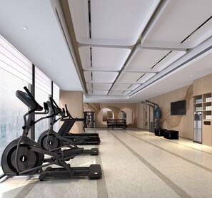 A modern gym with treadmills, a weight bench, and a wall-mounted TV. - Hilton Garden Inn Chongqing Yubei Central Park (Chongqing)