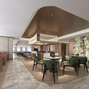 A modern hotel lobby with a curved ceiling, a central bar area, and green upholstered chairs around a round table. - Hilton Garden Inn Chongqing Yubei Central Park (Chongqing)