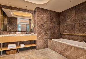 A modern bathroom with a marble vanity, a large mirror, and a freestanding bathtub. - Hilton Garden Inn Chongqing Yubei Central Park (Chongqing)