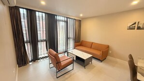 A modern living room with a sofa, a chair, and a coffee table.