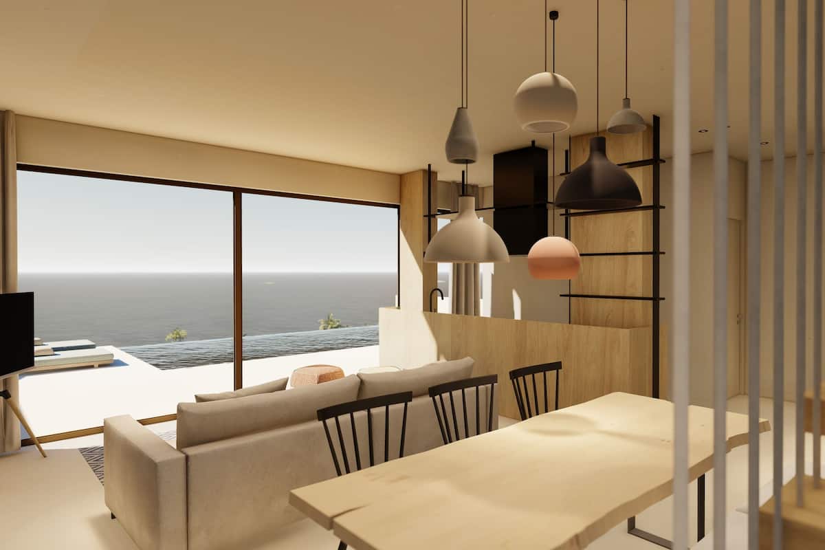 A modern living room with a large window overlooking the ocean, a wooden dining table, and a minimalist staircase.