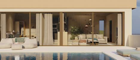 A modern hotel with a pool, a spacious living area with sofas and a coffee table, and a large sliding glass door entrance.